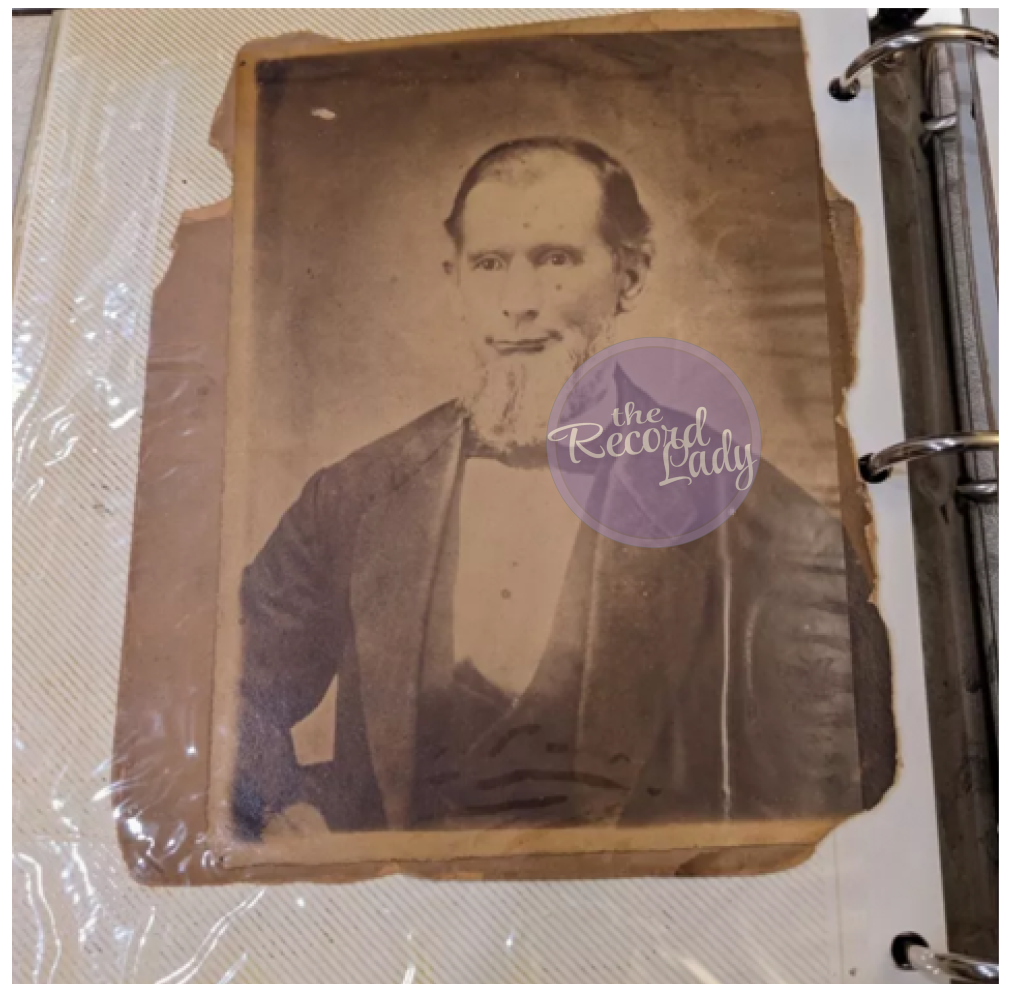 Photograph of the man with white beard in its original photo album position