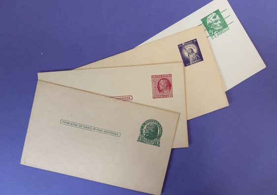 4 blank post cards with old pre-paid stamps